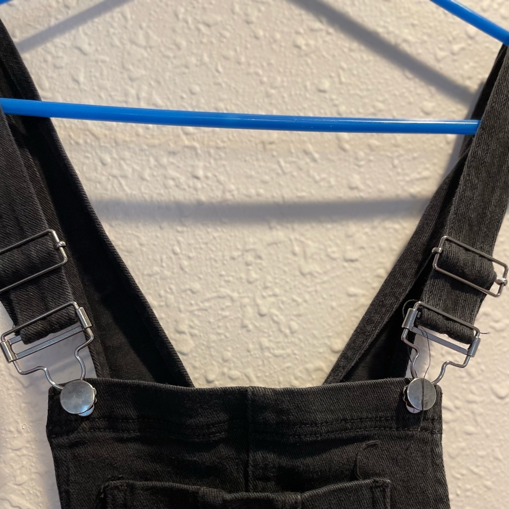Black Overalls with stylish Holes in legs. Forever 21. Size Small